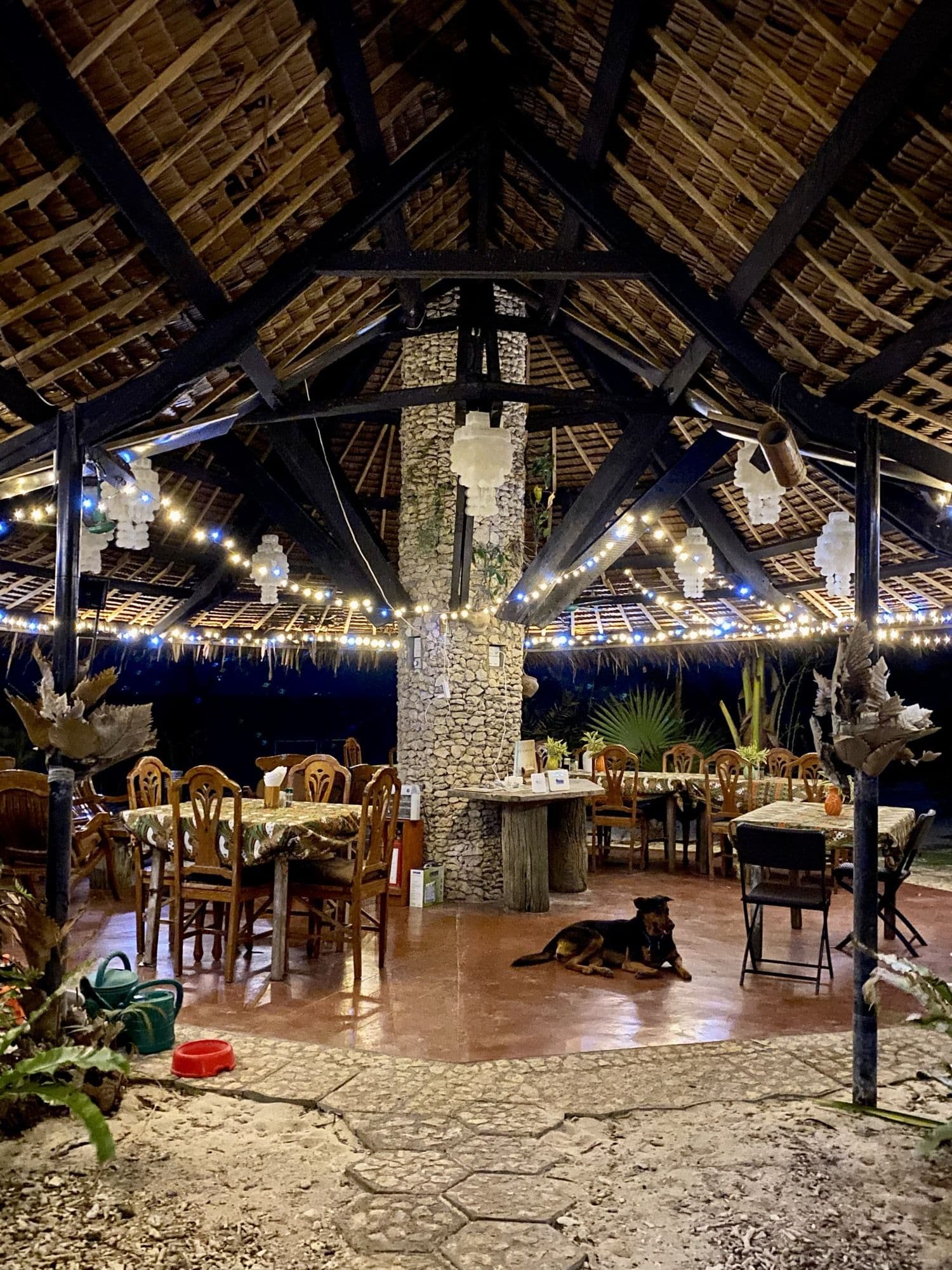 The al fresco beach bar beneath its nipa roof