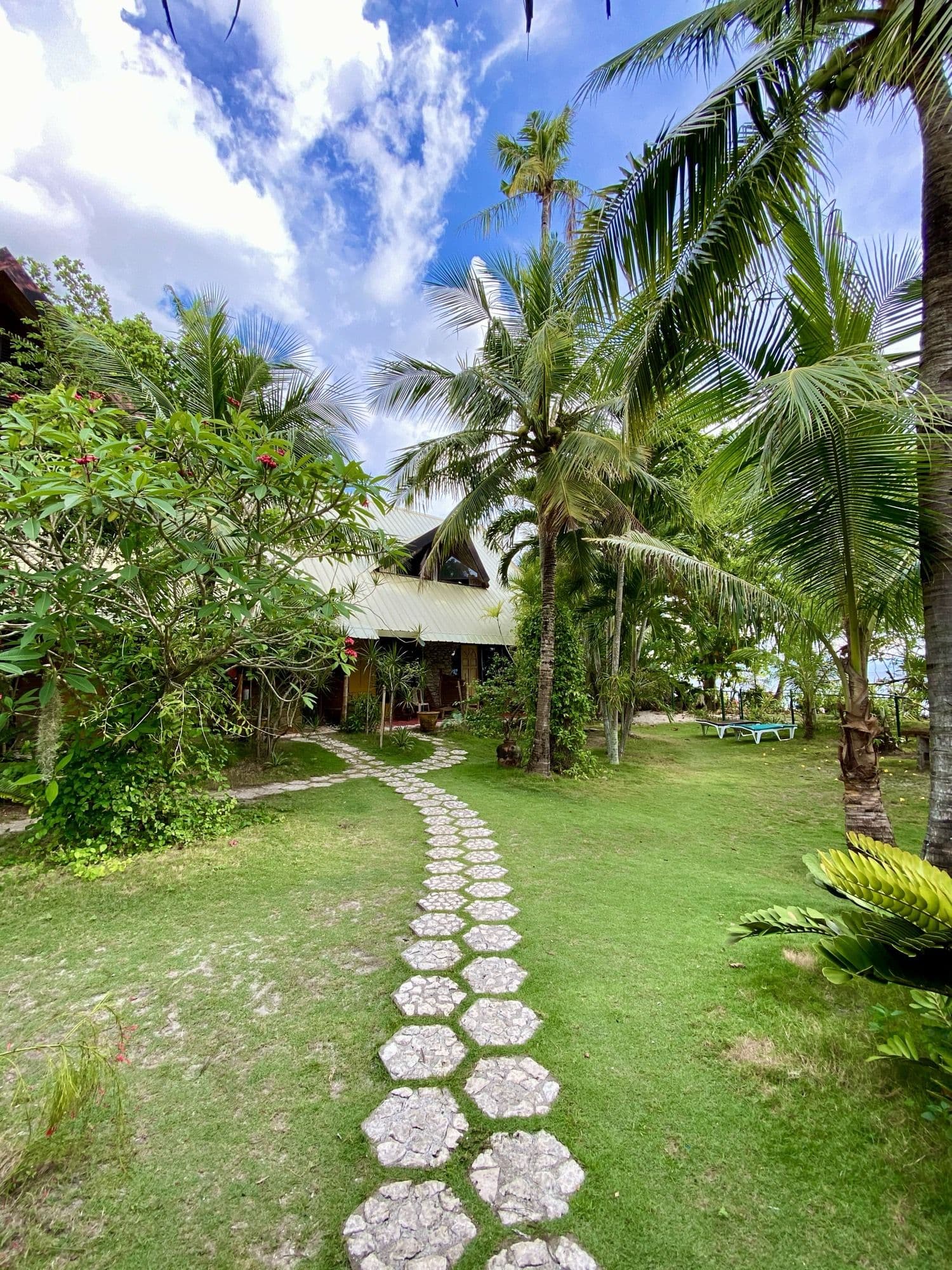 Stepping-stone path winding through the garden to the bungalows