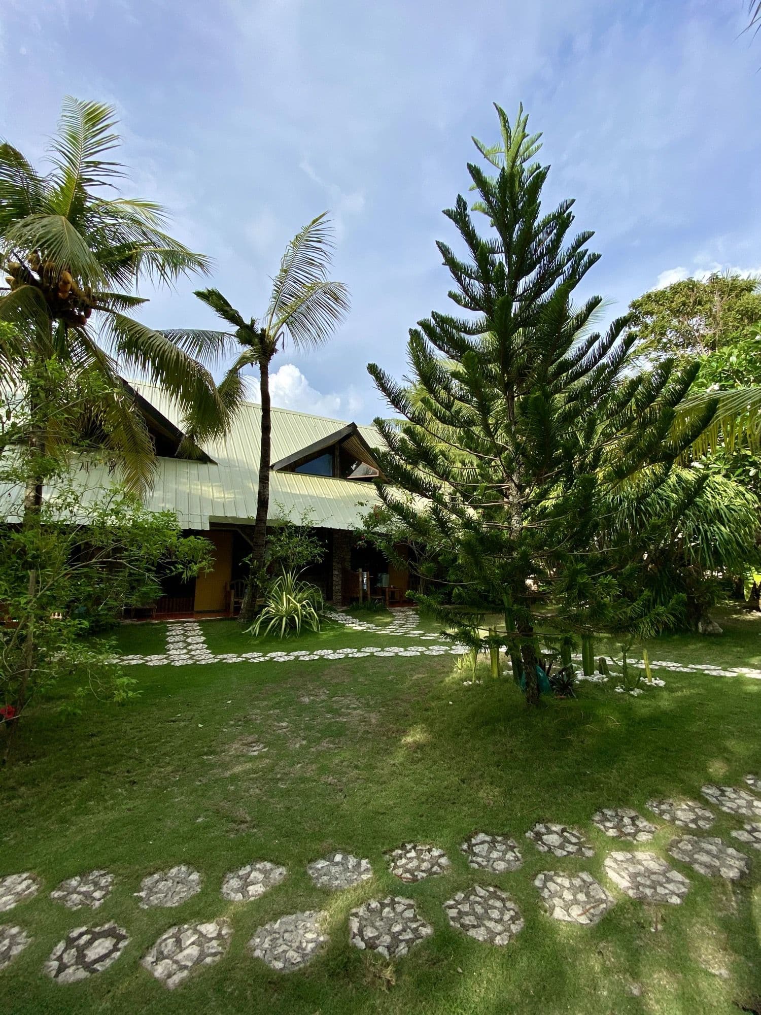 The lawn and stepping stones between the bungalows