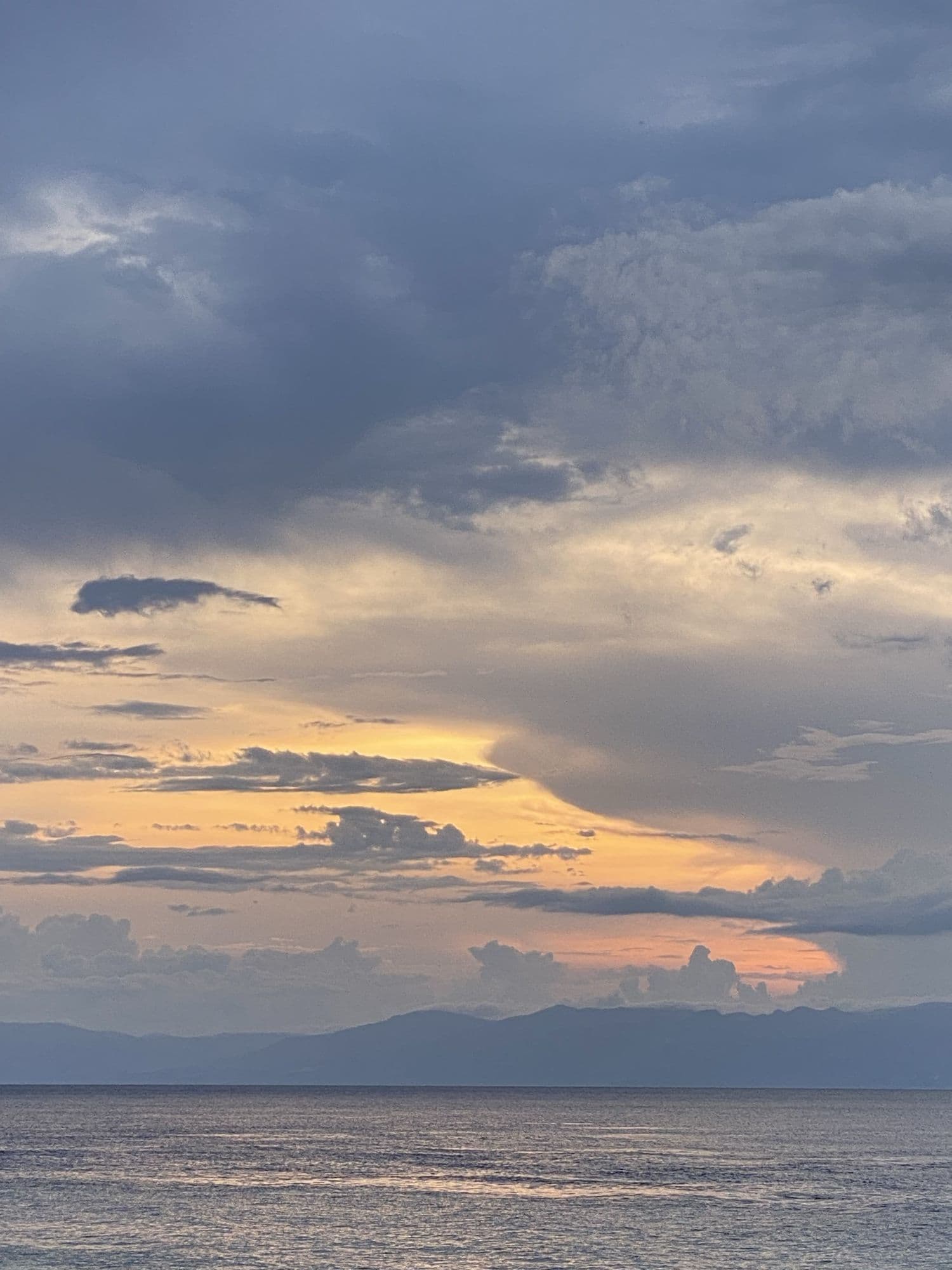 Evening clouds drifting over Tañon Strait